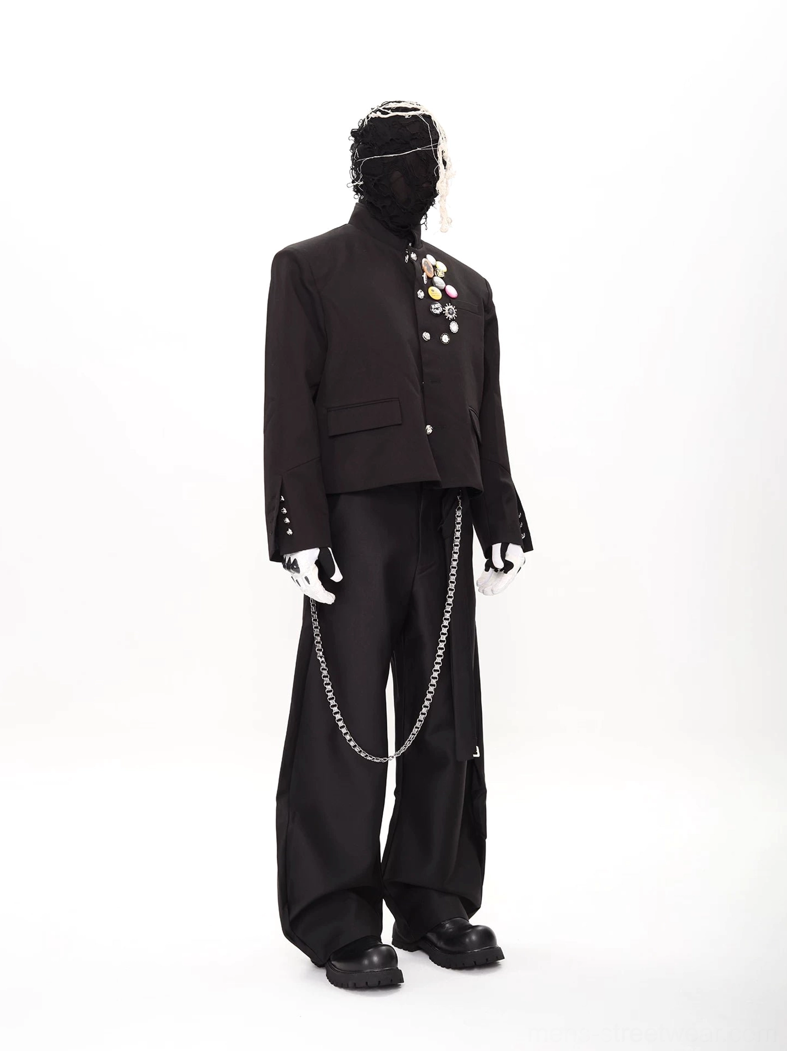 Right side view of punk scholar black cropped stand-collar blazer suit with wide-leg trousers and silver pants chain