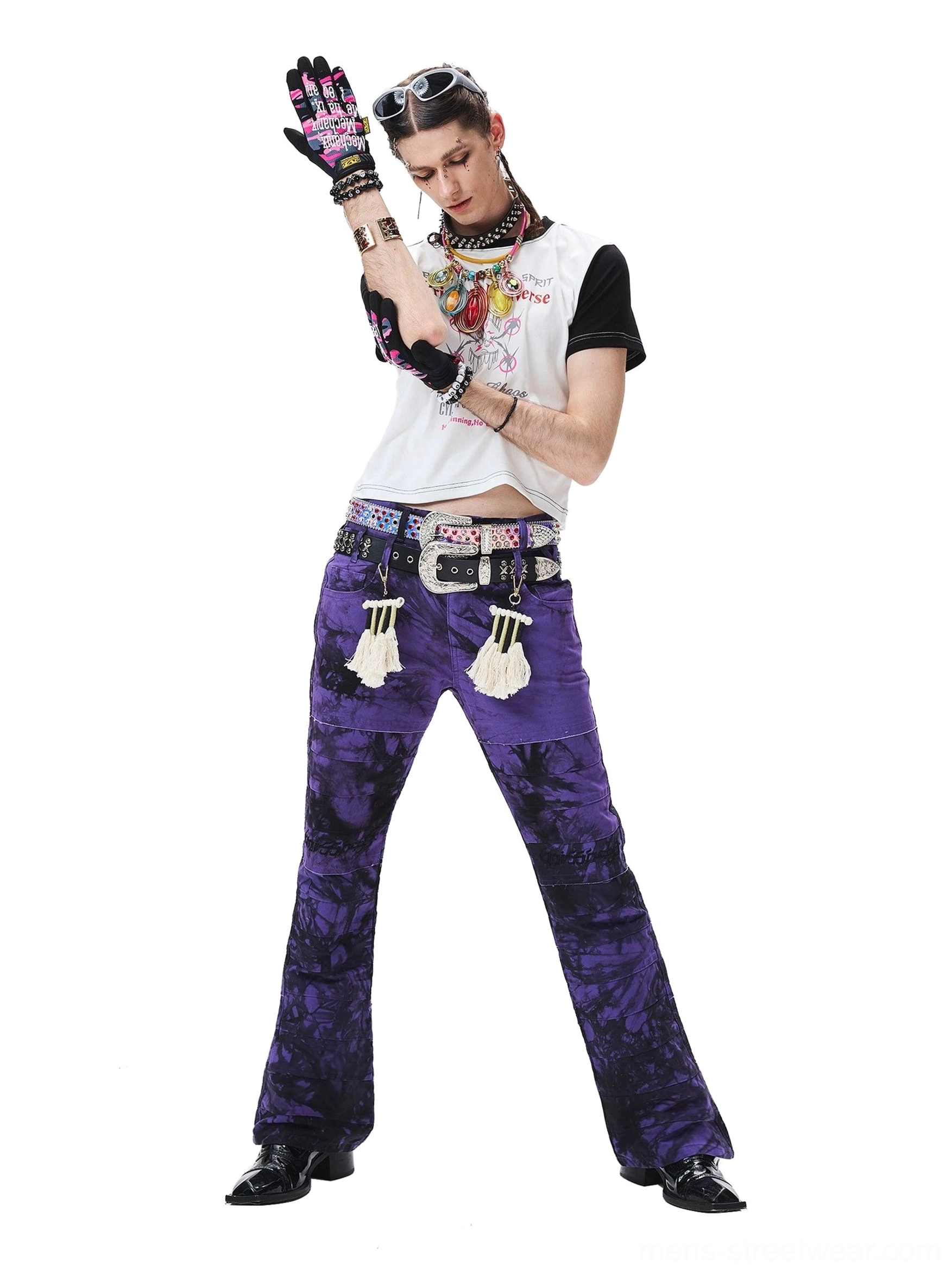 Three-quarter side view of purple-black flared trousers highlighting the layered waist and accessory styling