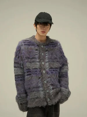 Close front view of a fuzzy purple gray plaid cardigan showing the relaxed drop shoulder silhouette and button-front crew neckline