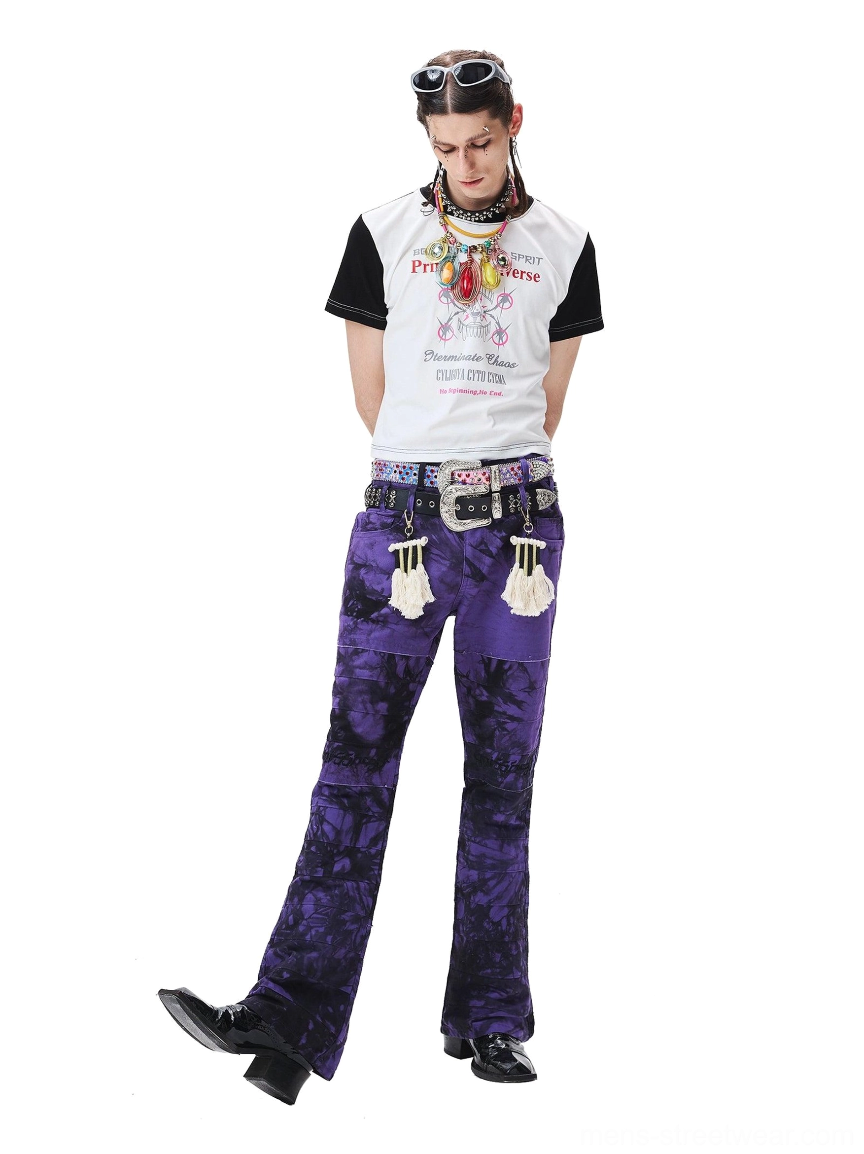 Dynamic side view of purple tie-dye wide-leg trousers showing the flared hem and movement