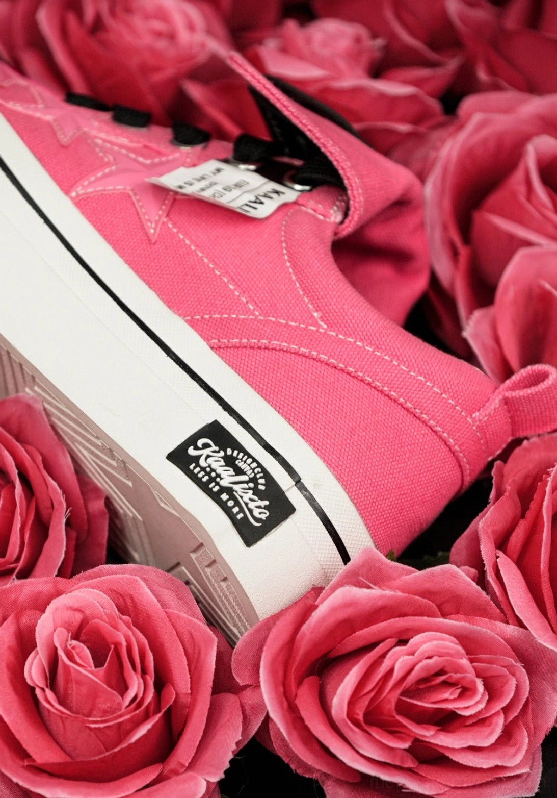 Raspberry pink platform canvas sneakers with black lace-up front and white sole for unisex casual streetwear styling