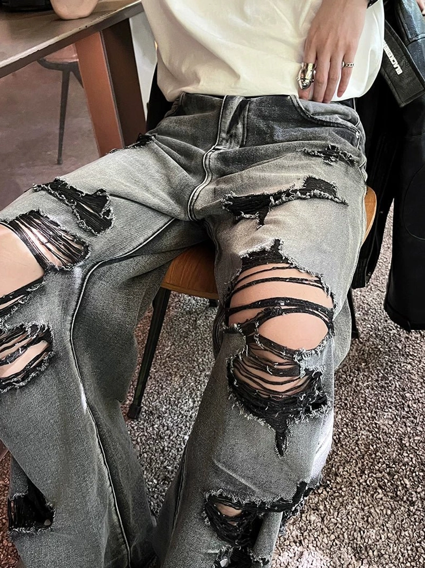 Ravaged Eclipse distressed gray wide-leg jeans with heavy ripped detailing, faded black-gray wash, and bold Korean punk streetwear styling