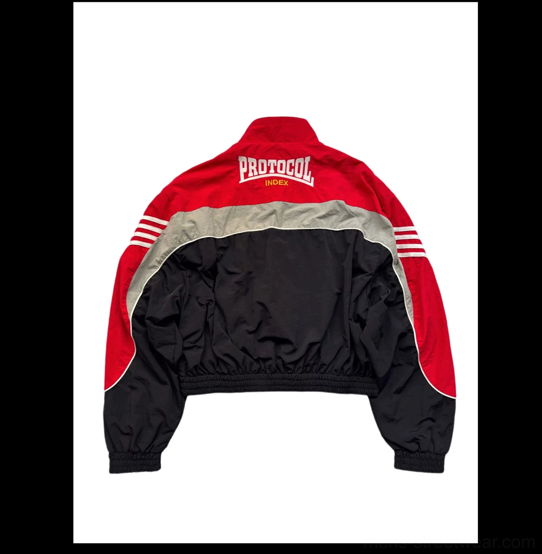 Back flat lay of red black and silver grey cropped track jacket with elasticated waistband and rear wordmark graphic