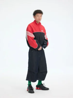 Side view of men's red black cropped nylon track jacket with contrast piping and triple white sleeve stripes