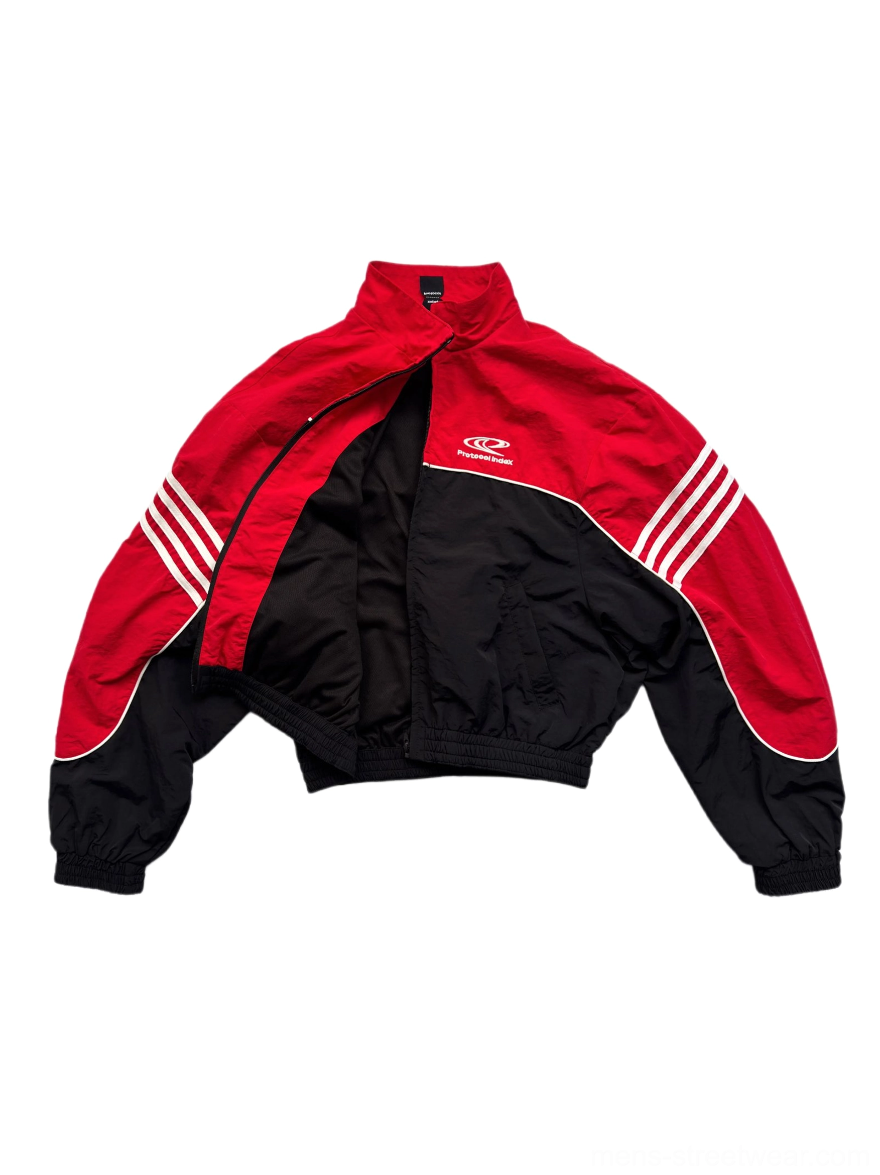 Close-up flat lay of red black cropped track jacket showing chest emblem front zipper white sleeve stripes and elastic cuffs