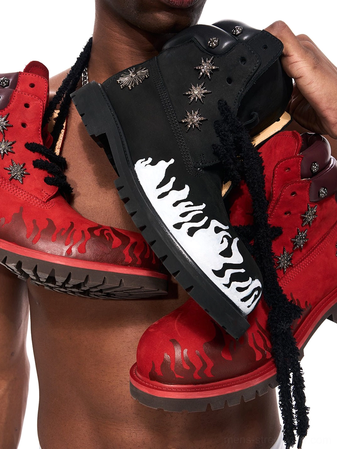 Close view of red and black flame genuine leather combat boots highlighting contrast flames and thick laces