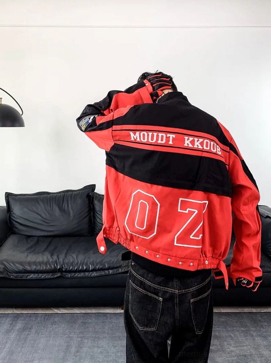Back view of a red and black motorcycle racing varsity jacket with large graphic detailing and adjustable waist hem
