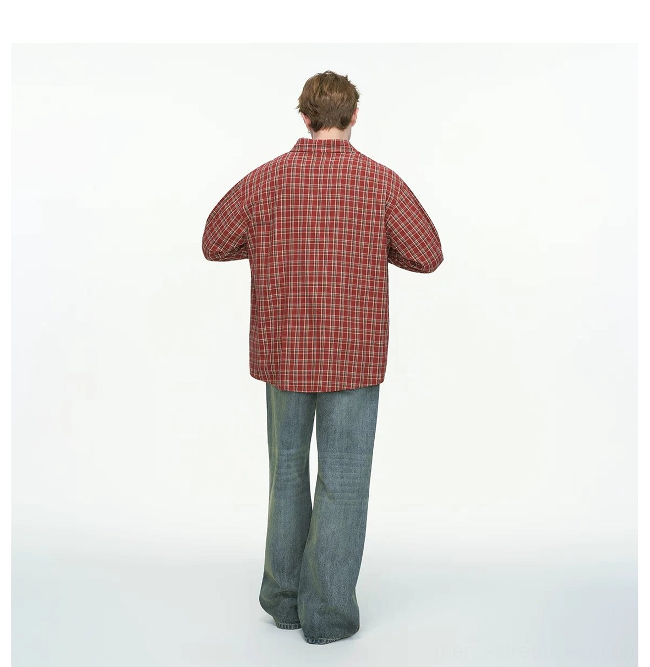 Back view of red oversized plaid button-up shirt showing the relaxed longline silhouette and back yoke