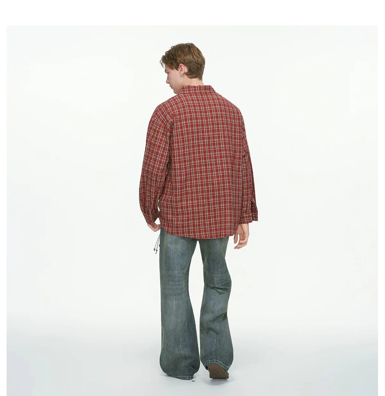 Side back view of red plaid oversized shirt featuring dropped shoulders loose hem and long sleeves