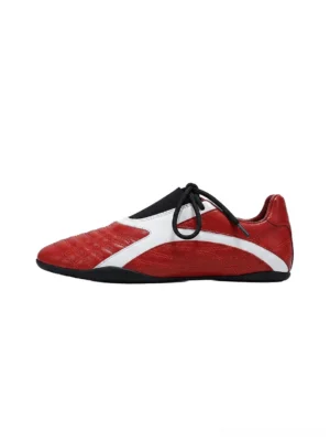 Red quilted-panel flat sole sneakers with white side stripe black laces and low-profile rubber sole on white background