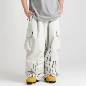 Off white reflective flame cargo snow pants shown from the front with an oversized straight leg fit, large cargo pockets, and snow boots