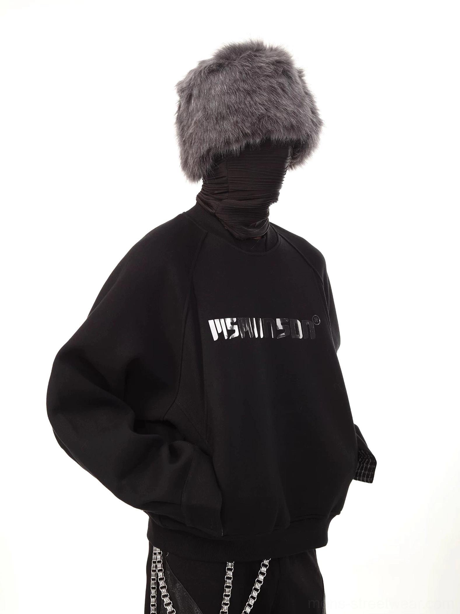 Side view of black oversized reflective logo raglan sweatshirt in layered Korean streetwear styling