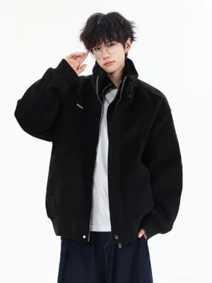Black wool-look stand collar bomber jacket styled with a white T-shirt and dark wide-leg jeans in a modern streetwear outfit