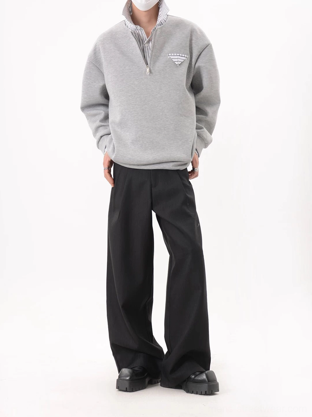 Relaxed Korean style heather gray quarter-zip sweatshirt with striped cuffs and inner collar styled with black trousers