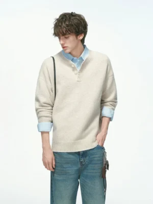 Men's relaxed henley knit sweater in beige apricot with soft brushed texture, button placket, loose streetwear fit and layered blue shirt styling