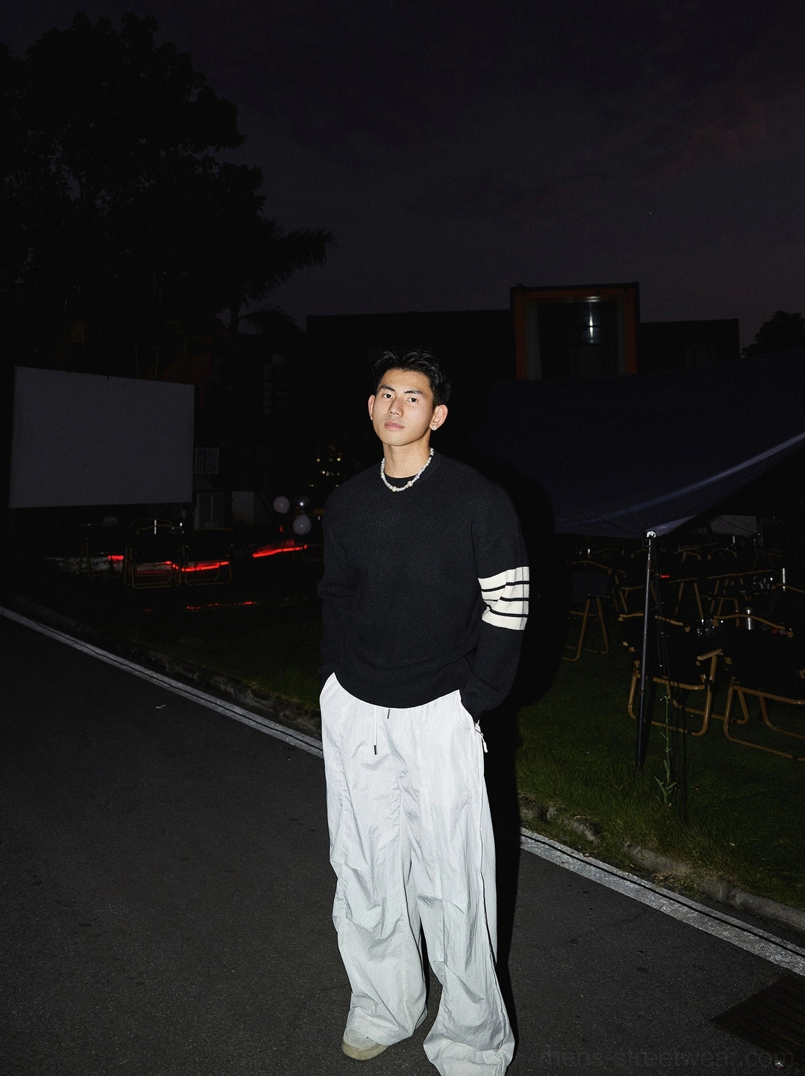 Relaxed Korean streetwear crewneck knit sweater with contrasting striped sleeves, modern oversized silhouette, and versatile urban styling