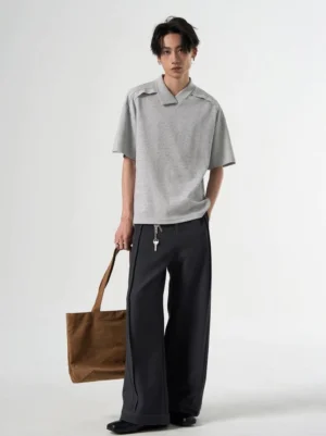 Gray relaxed open collar knit polo tee full body streetwear outfit with wide leg black trousers