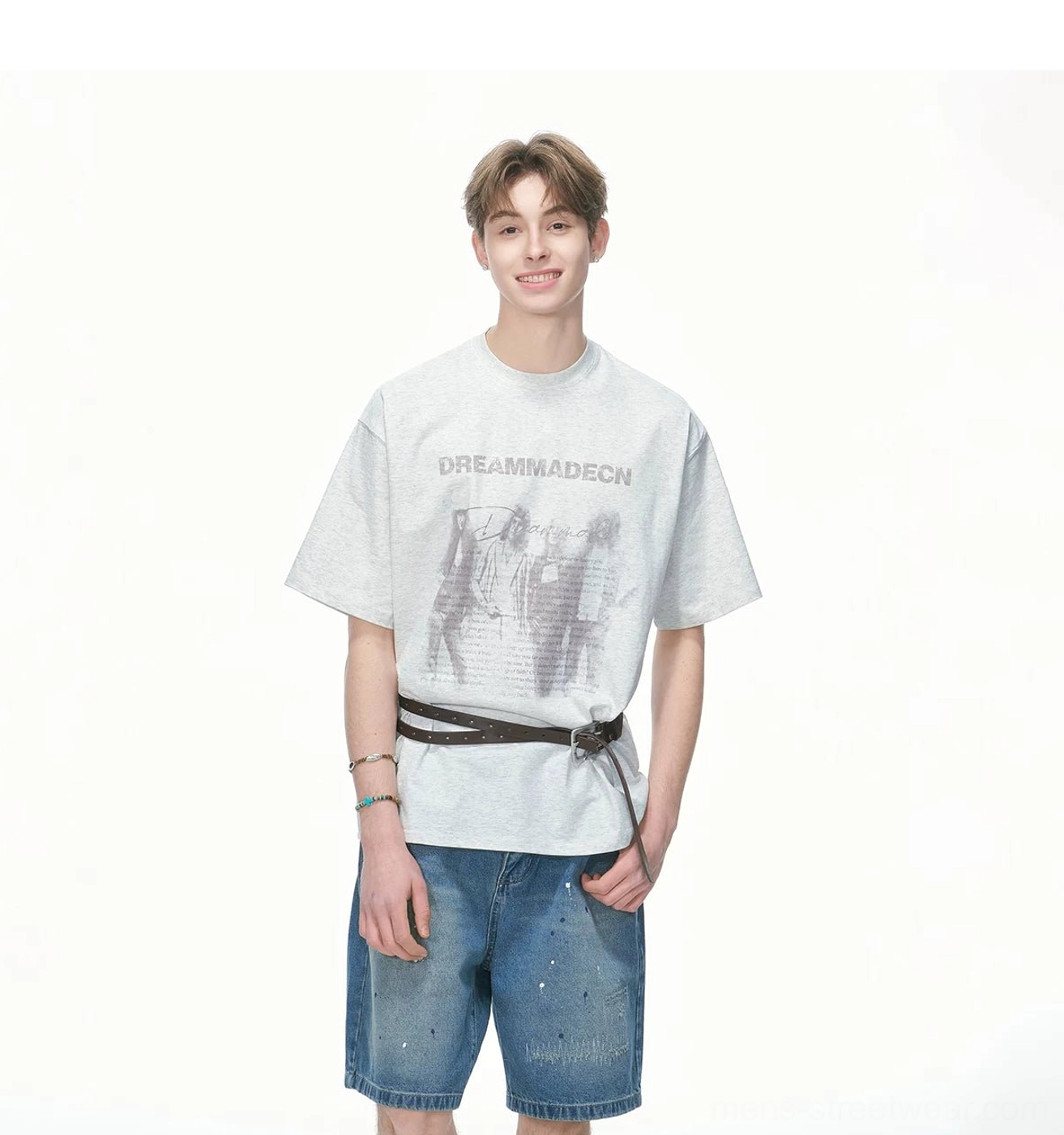 Relaxed oversized crew neck graphic T-shirt with vintage artwork styled with denim shorts and a leather waist belt