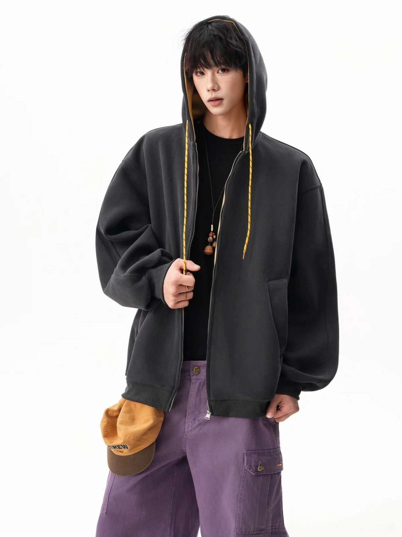 Relaxed oversized fleece hoodie with full zip closure, adjustable hood, and streetwear layering design