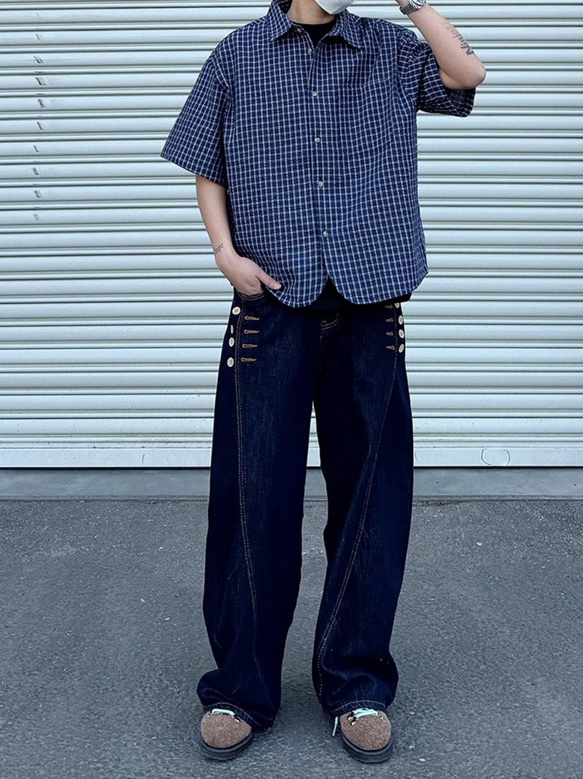 Relaxed oversized plaid short sleeve button shirt styled with dark wide leg denim and contemporary Asian fashion outfit