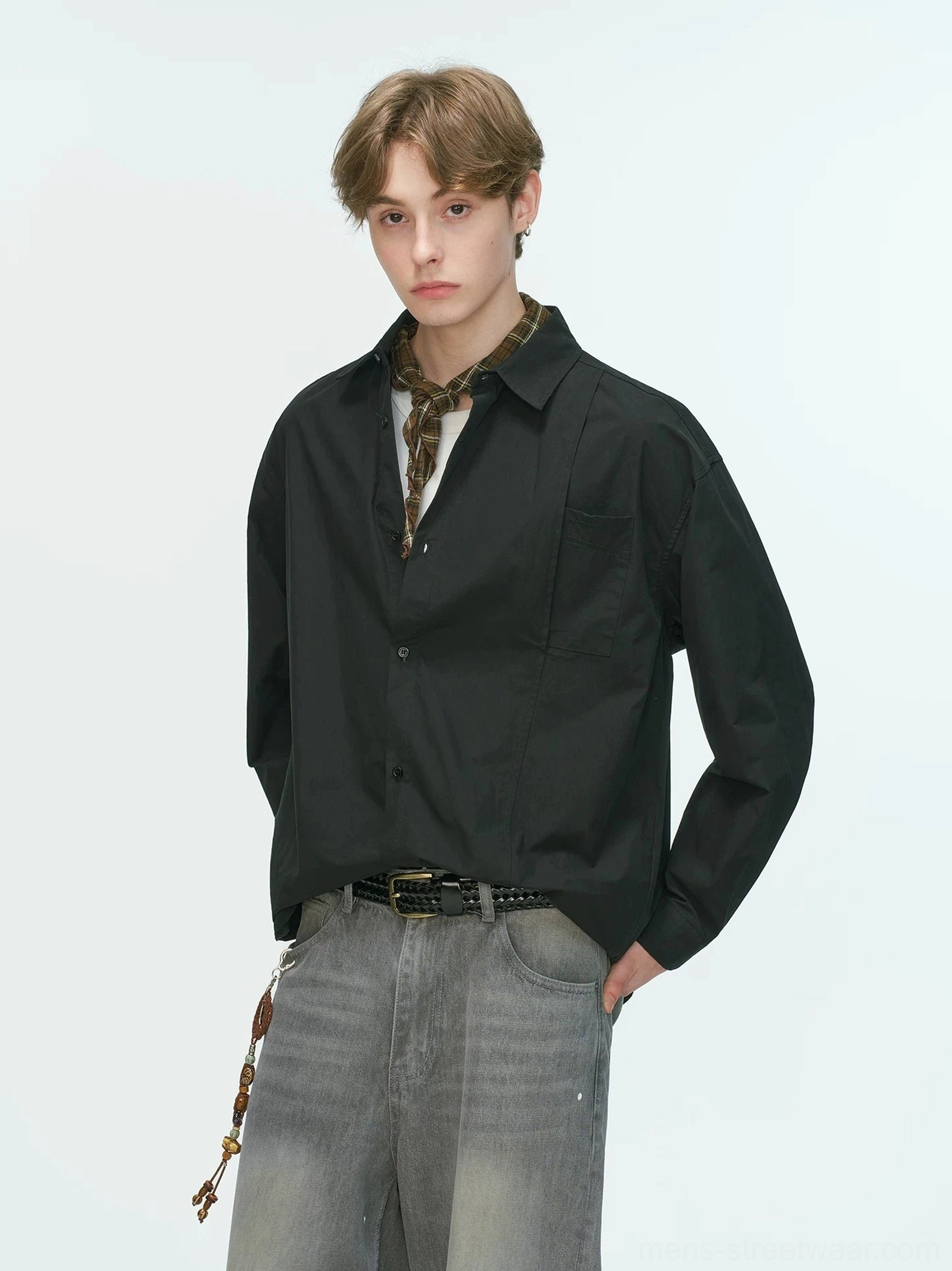 Black relaxed poplin shirt with pointed collar styled with a patterned neckerchief and wide-leg gray denim