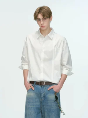 White relaxed poplin shirt styled with wide-leg denim jeans and leather belt in a clean Korean fashion outfit