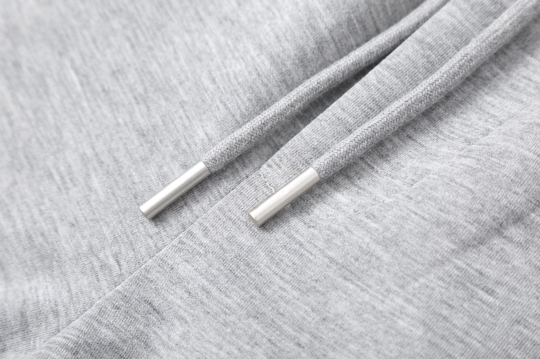 Relaxed slanted spliced sweatpants designed for Seoul streetwear outfits and casual urban styling