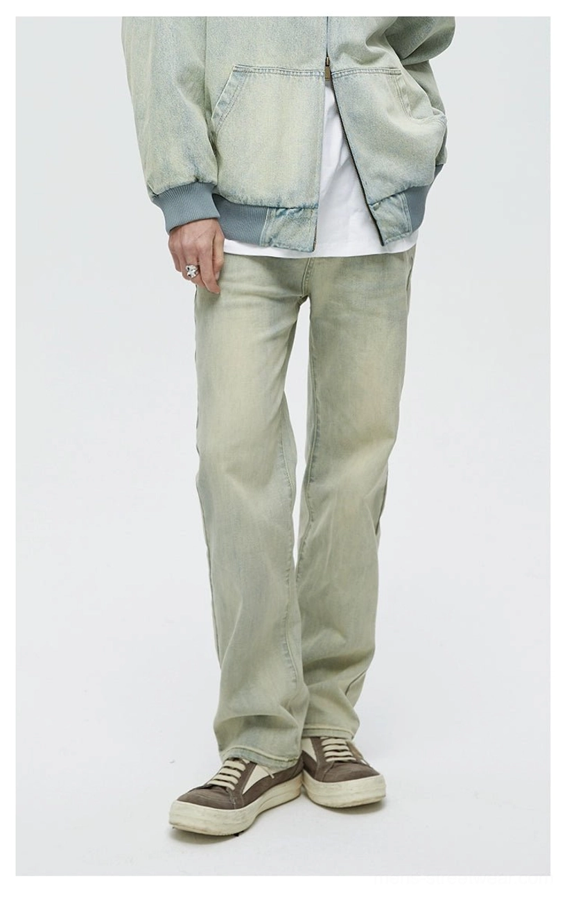 Relaxed straight-leg denim jeans paired with a cropped denim jacket, basic tee, and retro sneakers