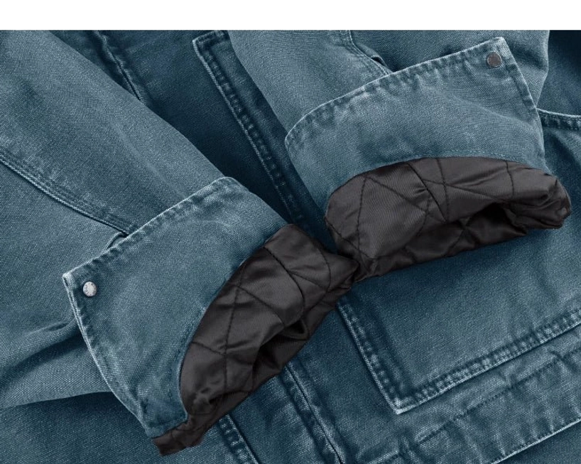 Relaxed workwear streetwear jacket featuring two-tone cotton canvas construction, quilted lining, and oversized utility pockets