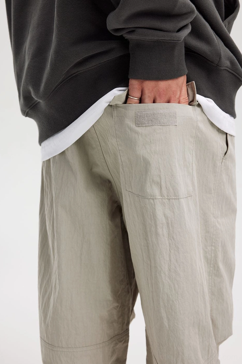 Relaxed utility-inspired wide-leg drawstring pants designed for layered Acubi and East Asian streetwear outfits
