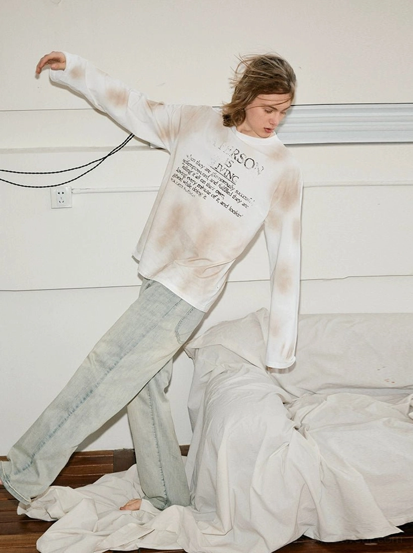 Side view of relaxed vintage straight-leg jeans styled with a tie-dye long-sleeve shirt for an effortless Seoul streetwear outfit