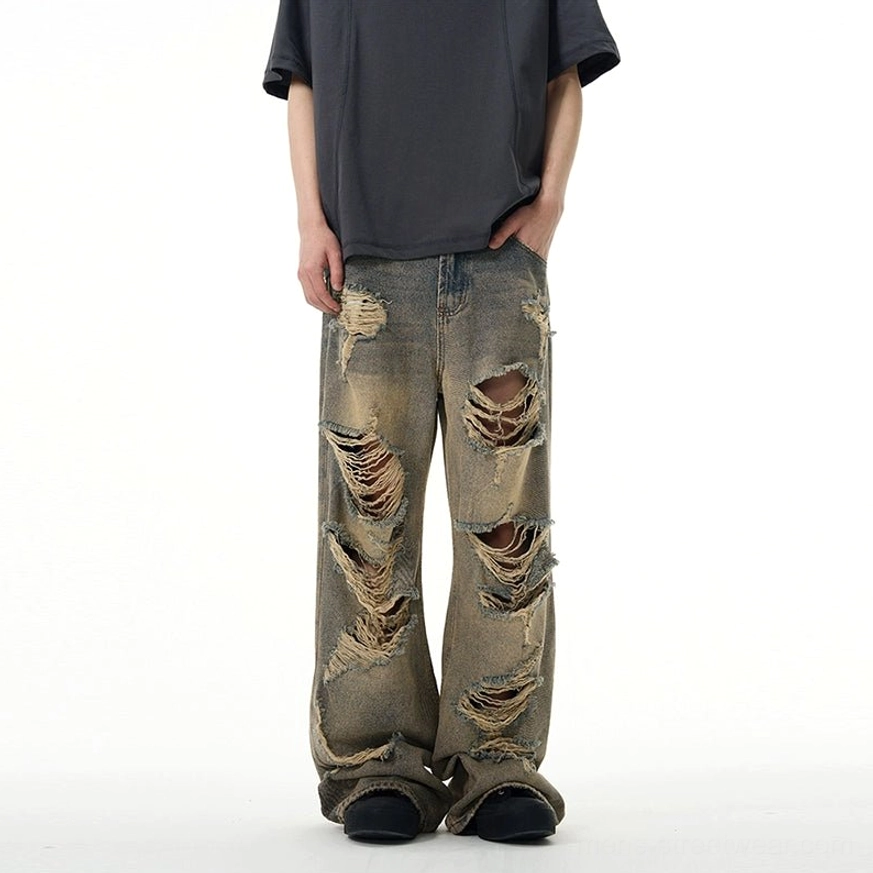 Front full-body view of retro blue distressed wide-leg ripped jeans with loose oversized streetwear silhouette