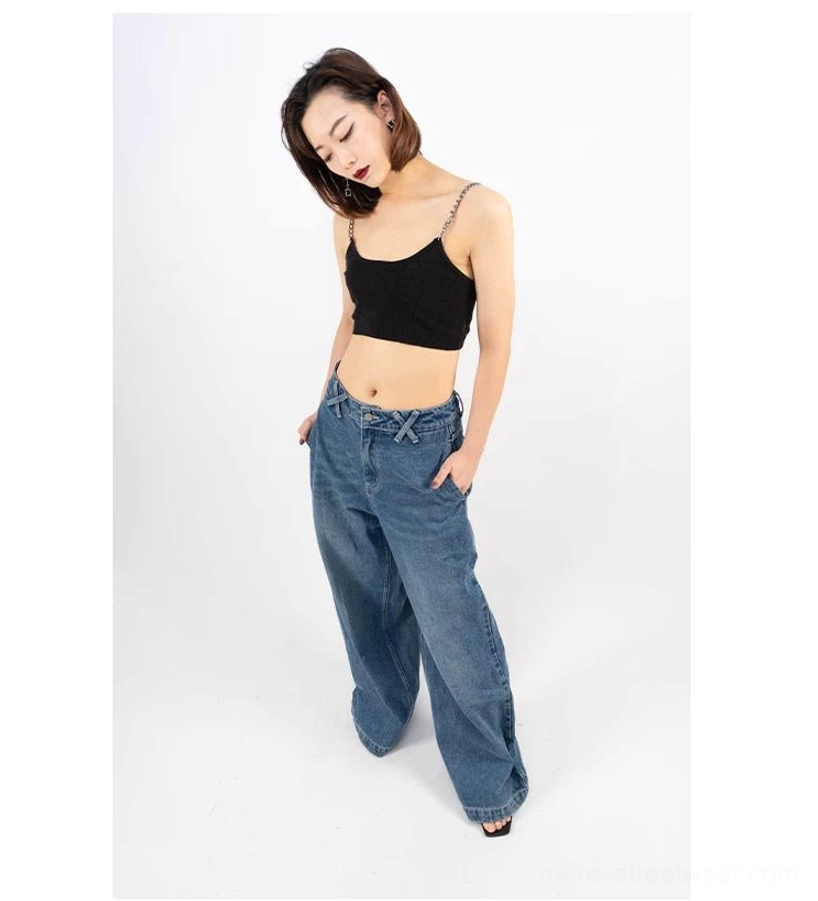 Retro blue oversized puddle jeans front three-quarter view styled with black camisole for Seoul streetwear outfit