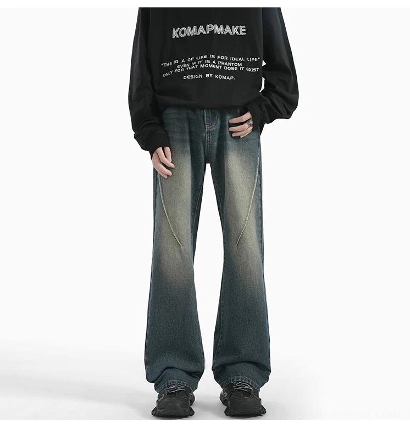 Front styling view of Retro Blue Sunfade Arc Flare Jeans with neat hem, diagonal seams, and chunky sneaker-ready fit