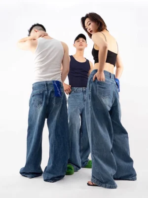 Retro blue ultra wide-leg puddle denim jeans rear three-quarter group view with oversized baggy streetwear fit
