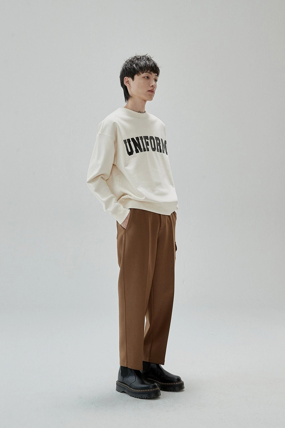 Retro collegiate sweatshirt designed with a roomy silhouette for contemporary urban layering