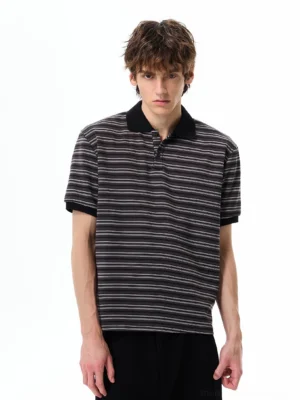 Black retro contrast-stripe polo shirt with solid black collar and cuffs styled with black wide-leg trousers in a Korean streetwear outfit