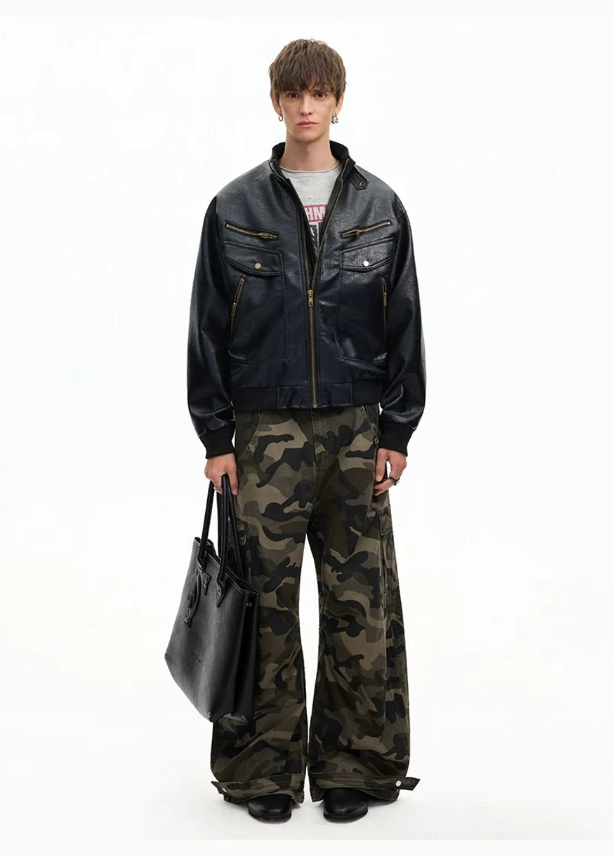 Black oversized faux leather moto bomber jacket with utility pockets and camouflage cargo pants