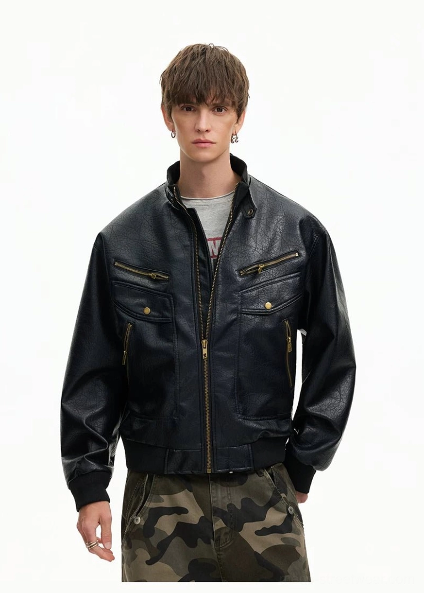 Black faux leather moto bomber jacket showing ribbed hem cuffs chest zip pockets and snap flaps