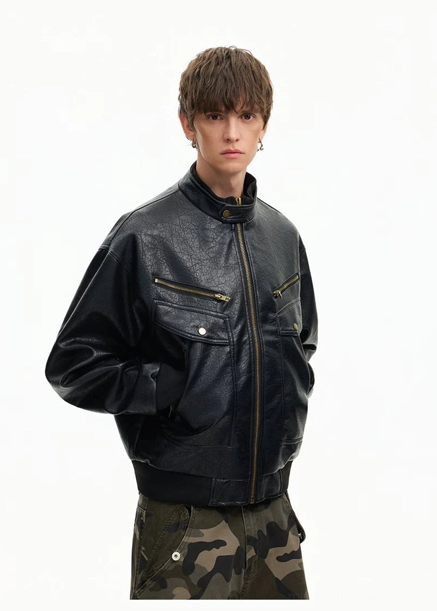 Side view of black retro faux leather moto bomber jacket with relaxed silhouette and vintage hardware