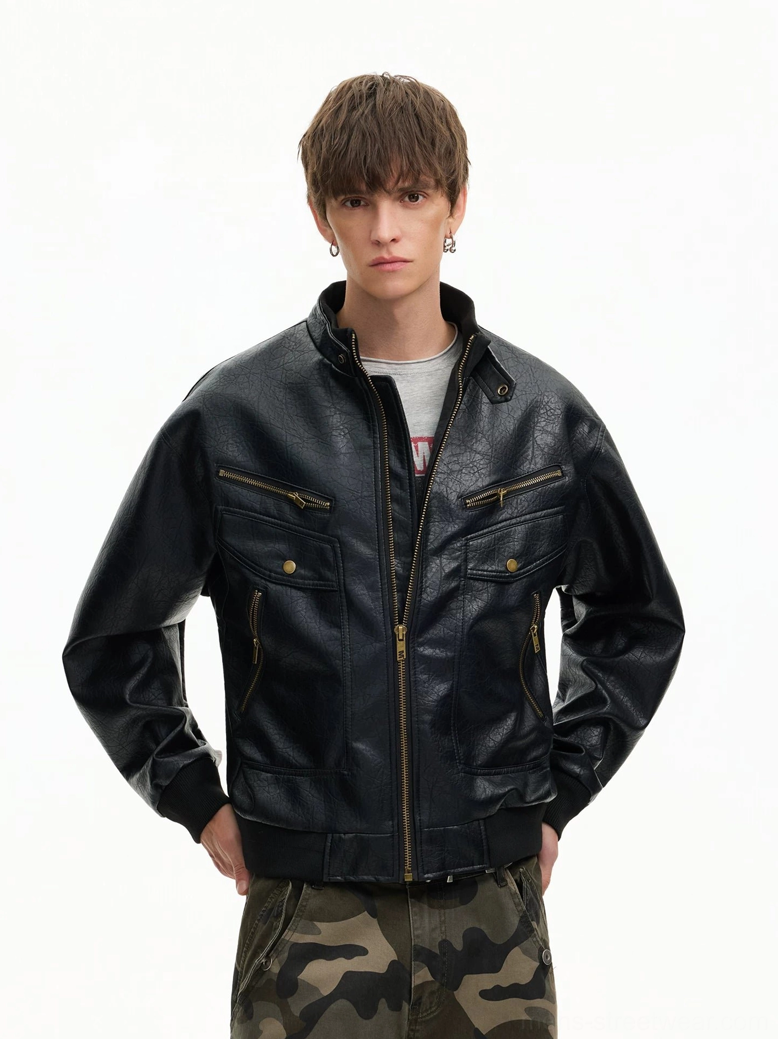 Black retro faux leather moto bomber jacket styled with grey t-shirt and camouflage cargo pants