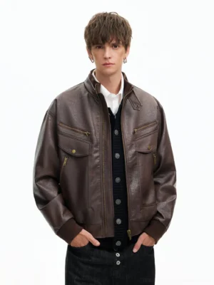 Brown retro faux leather moto bomber jacket with stand collar and utility flap pockets front view