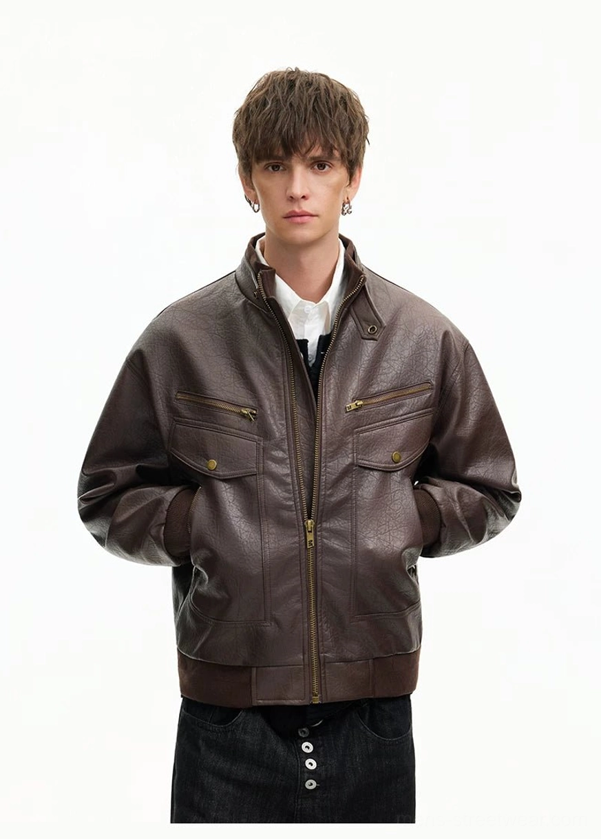 Brown textured faux leather utility bomber jacket with zip front and snap flap chest pockets