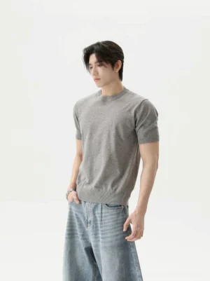 Heather gray retro knit short sleeve T-shirt shown from a three quarter front view on a male model, featuring fine knitted texture, ribbed crew neck, and clean Korean streetwear styling