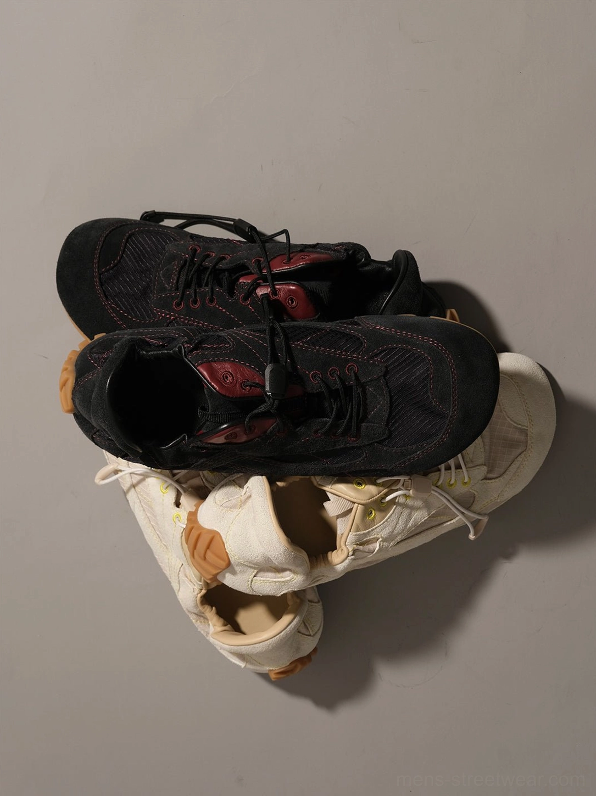 Retro-inspired low-profile trainers with rounded toe, offset lacing, nubuck upper, and ridged gum heel