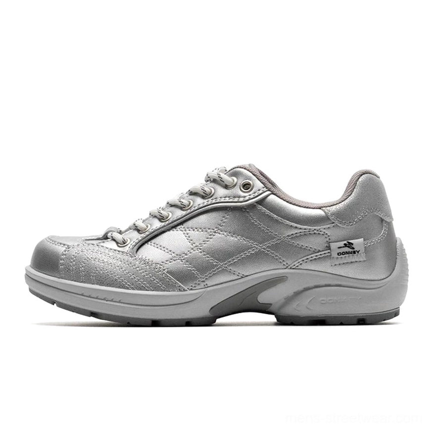 Retro runner sneakers featuring layered streetwear panels, rounded toe, detailed contrast stitching, lace-up closure, and cushioned sole