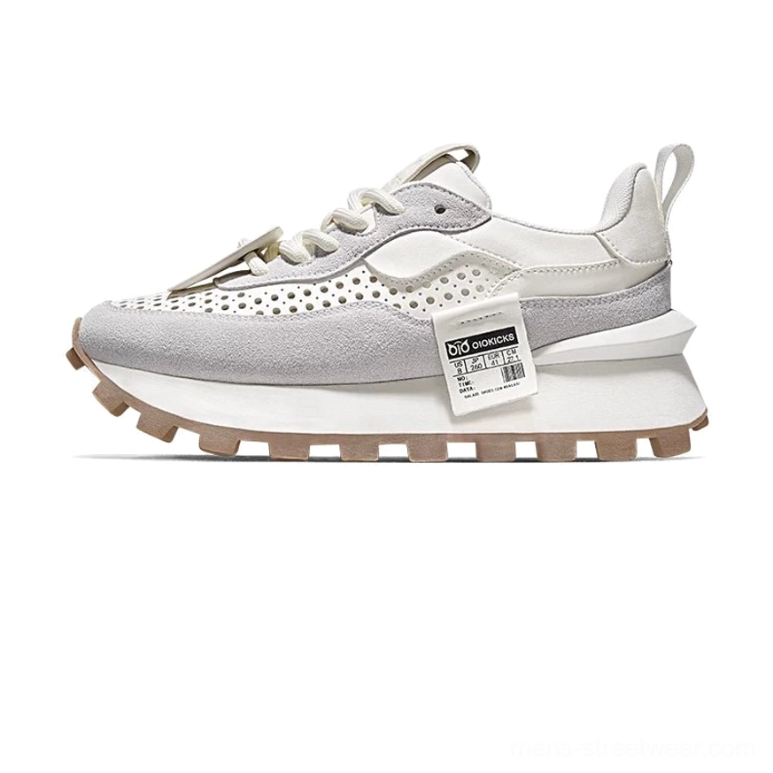 Direct view of the rubber outsole on retro running sneakers with wavy anti-slip lug traction pattern and durable streetwear grip