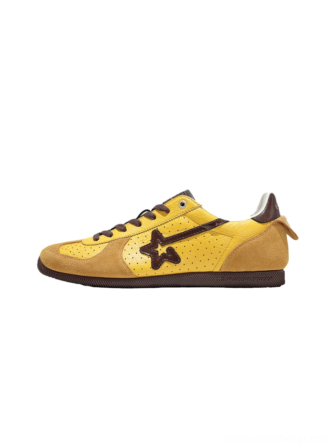 Yellow and dark brown suede low-profile streetwear trainer with perforated upper, contrast star side motif, and lace-up closure