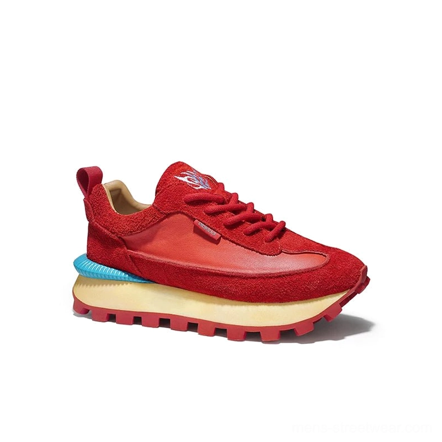 Red retro trail fusion leather sneaker front three-quarter view with blue heel accent and textured upper