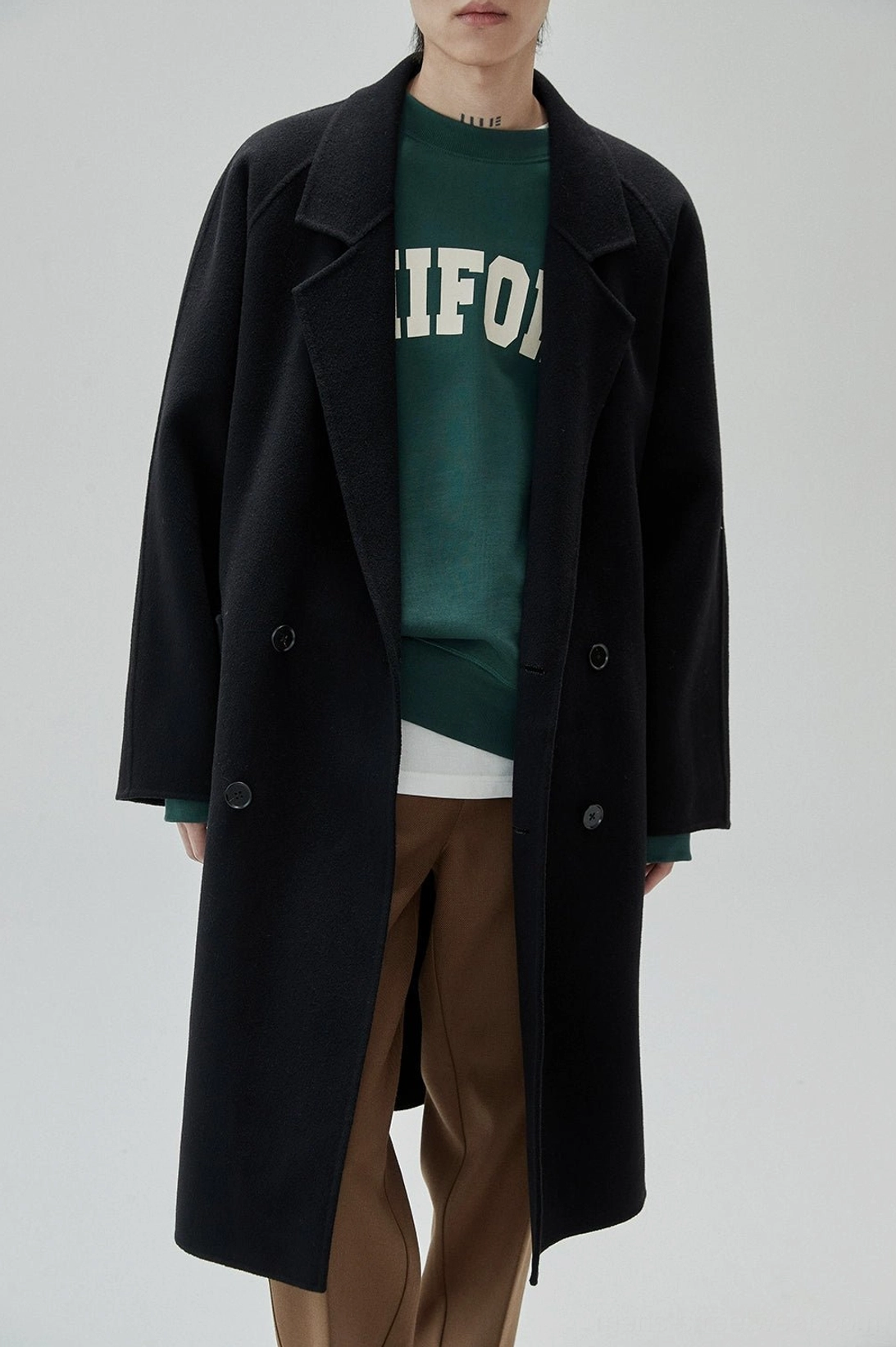 Retro UNIFORM crewneck sweatshirt featuring collegiate typography and easy layered styling